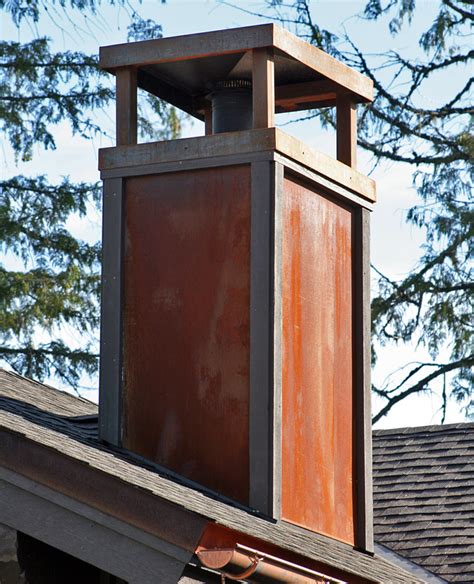 cape house with a metal chimney cap|chimney caps for homes.